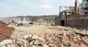 demolition in progress at a brownfield, or previously developed, industrial site, to prepare for redevelopment