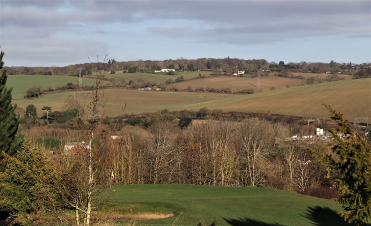 beautiful countryside in the sunshine, with rolling green hills, fields and pastures