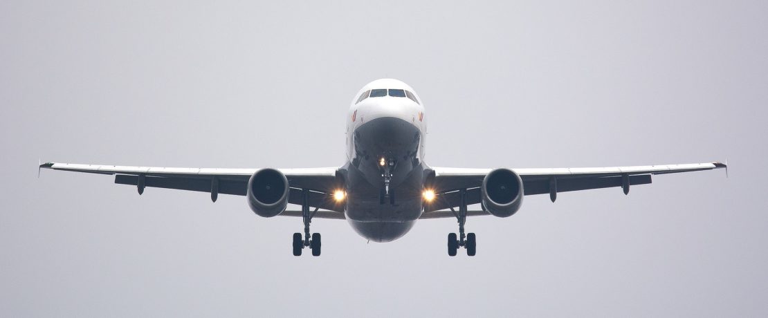 a large passenger aircraft preparing to land and looking quite threatening, we oppose airport expansion