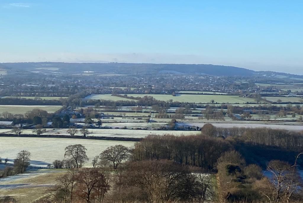 epic countryside view over the threatened Marshcroft site, including woodlands, green fields and hedgerows