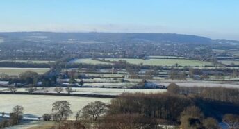 ong distance view overlooking many green fields and hedgerows