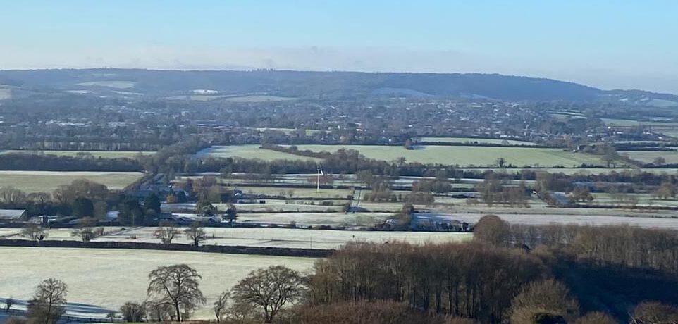 ong distance view overlooking many green fields and hedgerows