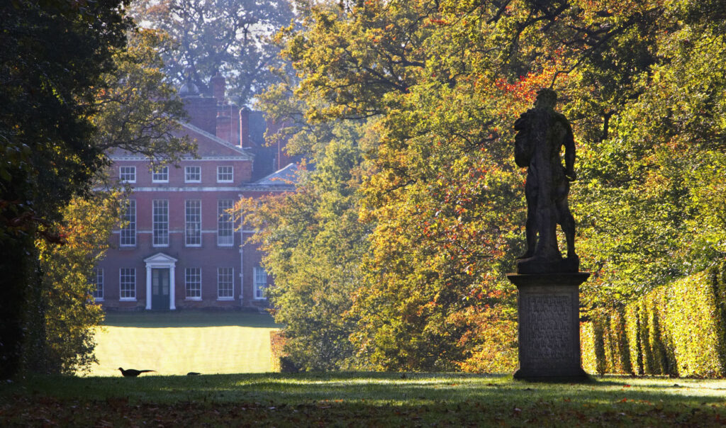 Garden with classical statuary and broad green avenue