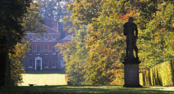 Garden with classical statuary and broad green avenue