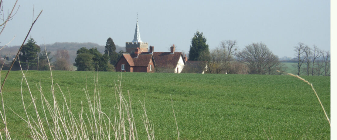 picturesque view of countryside and historic parish church