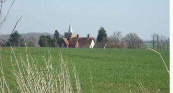 picturesque view of countryside and historic parish church