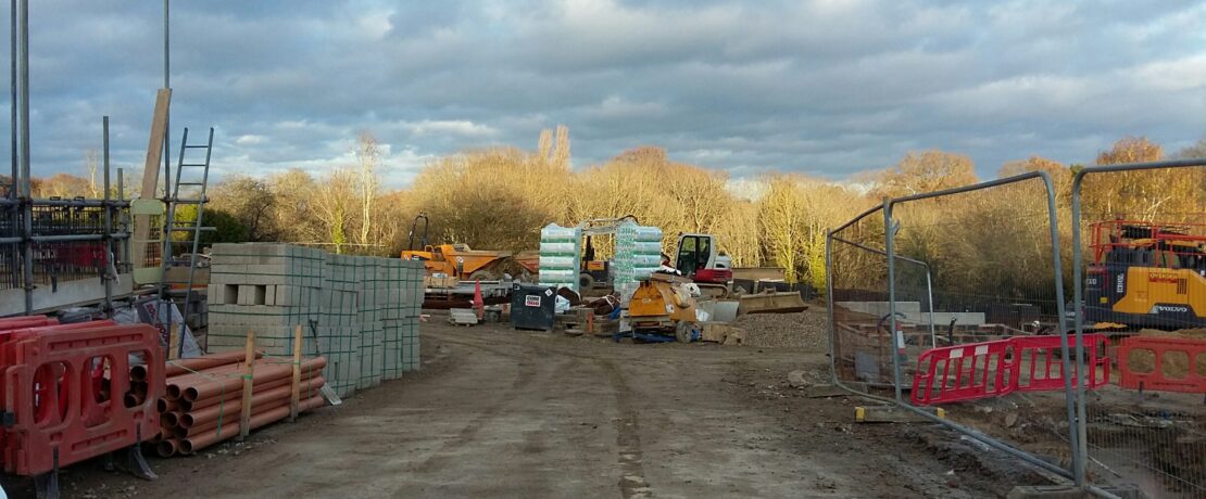 brownfield: a building site being cleared for redevelopment