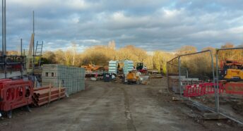 brownfield: a building site being cleared for redevelopment