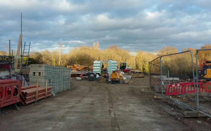 brownfield: a building site being cleared for redevelopment