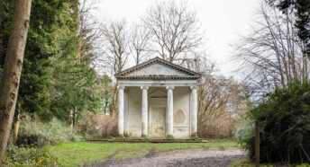 an ornate summer house in woodland