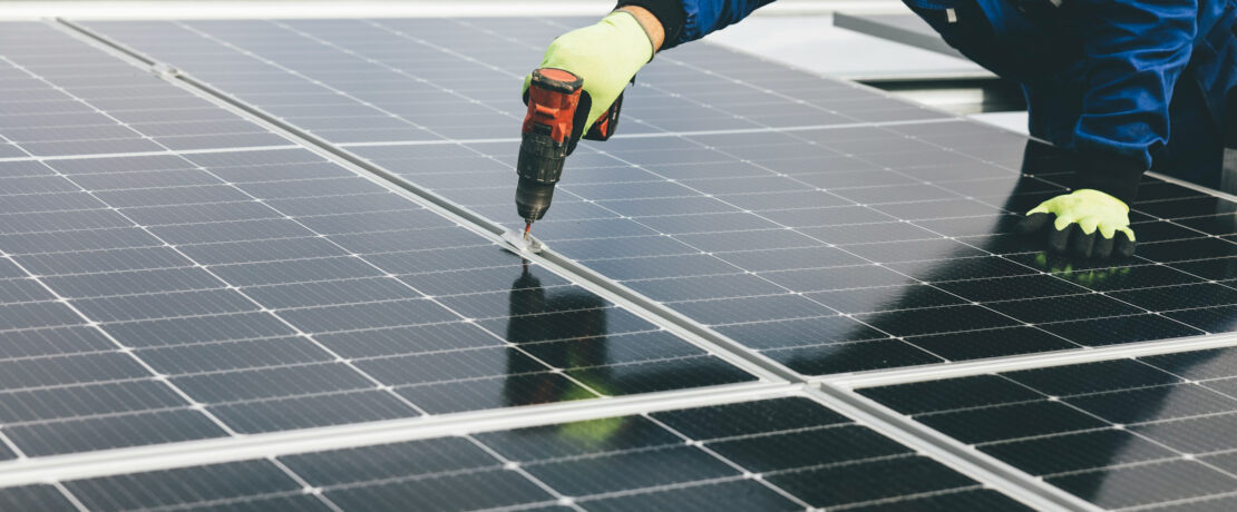 installation of solar panels on large rooftop