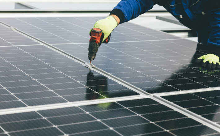 installation of solar panels on large rooftop