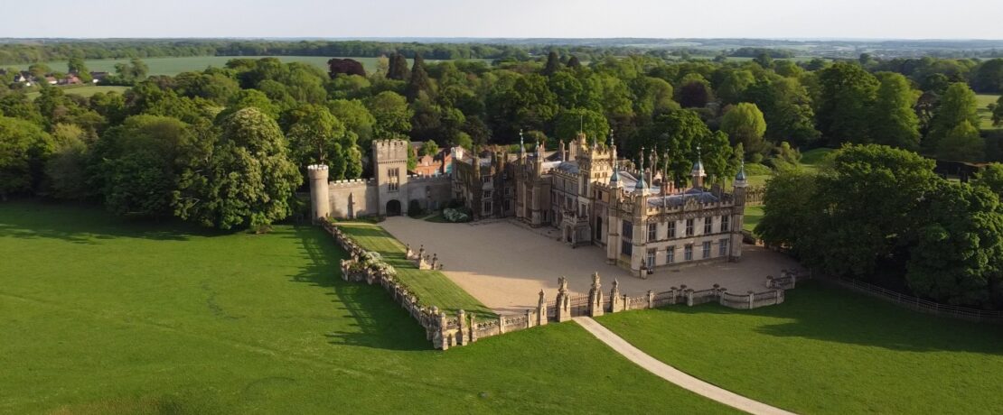 a beautiful stately home in a green landscape