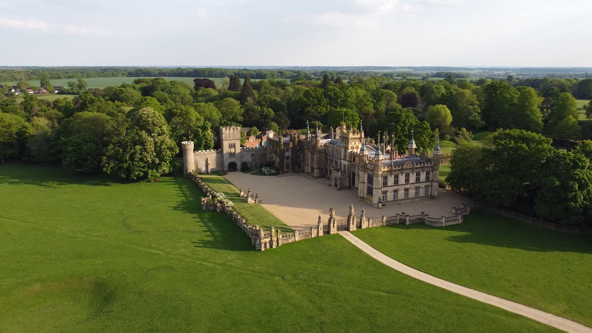 a beautiful stately home in a green landscape