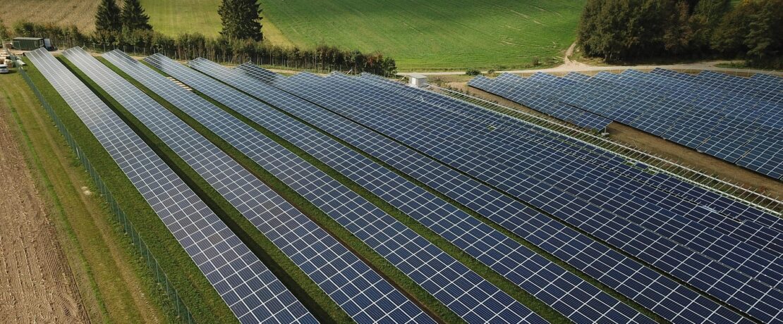 a solar farm on green fields