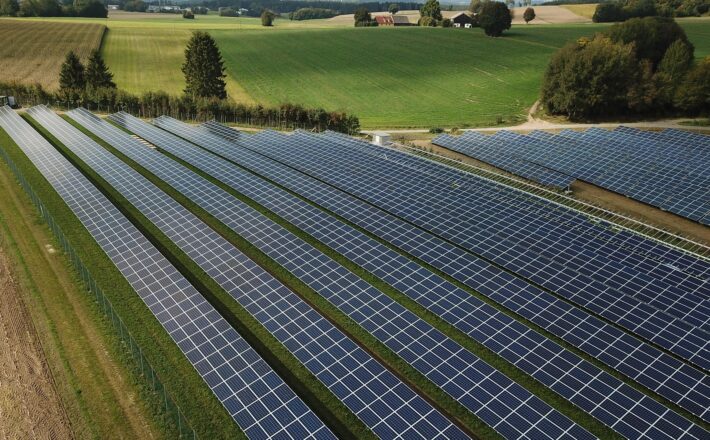 a solar farm on green fields