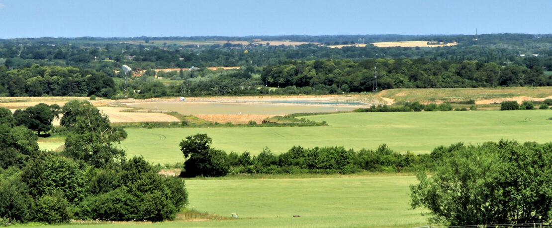 green fields, hedgerows and trees